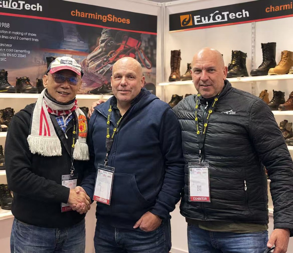 Charming Ever with clients at a trade show